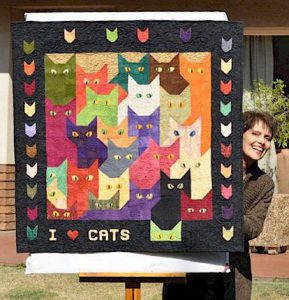 thelda with her Lots of Cats Quilt